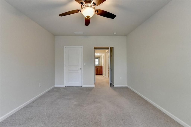 unfurnished bedroom featuring a ceiling fan, baseboards, and carpet flooring