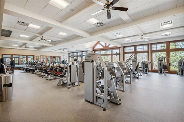 gym featuring a paneled ceiling, visible vents, and a ceiling fan