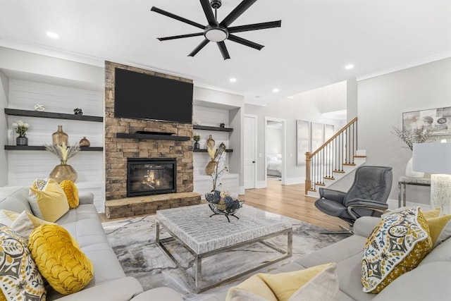 407 Estates View Dr, Acworth, GA 30101 - living room with ceiling fan, wood finished floors, stairs, recessed lighting, and a stone fireplace