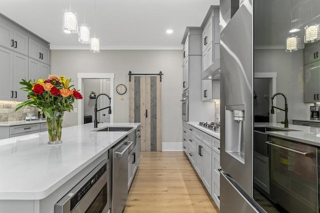 407 Estates View Dr, Acworth, GA 30101 - kitchen featuring a sink, light wood-type flooring, ornamental molding, appliances with stainless steel finishes, and backsplash
