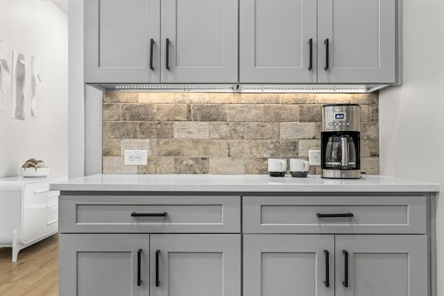 407 Estates View Dr, Acworth, GA 30101 - bar with tasteful backsplash and light wood-style floors