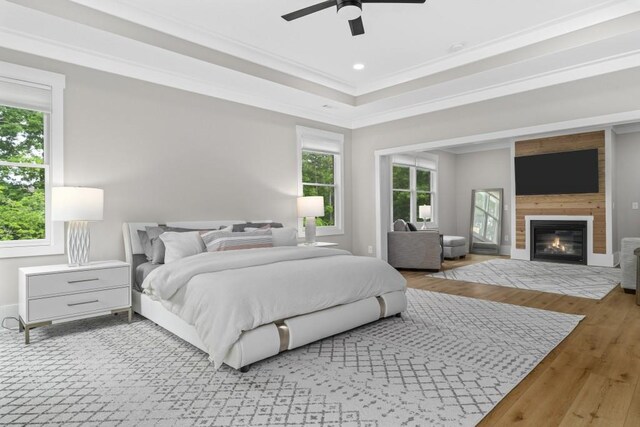 407 Estates View Dr, Acworth, GA 30101 - bedroom with crown molding, wood finished floors, a large fireplace, baseboards, and a ceiling fan