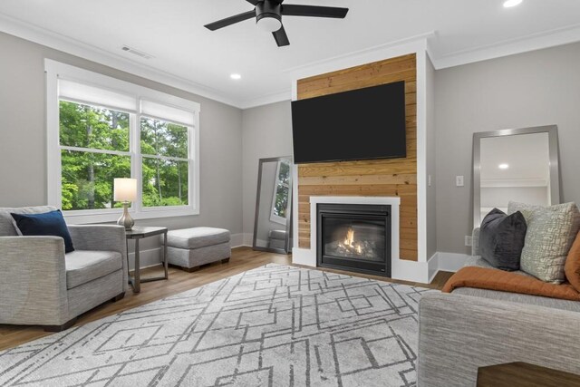 407 Estates View Dr, Acworth, GA 30101 - living area featuring crown molding, ceiling fan, recessed lighting, wood finished floors, and a large fireplace
