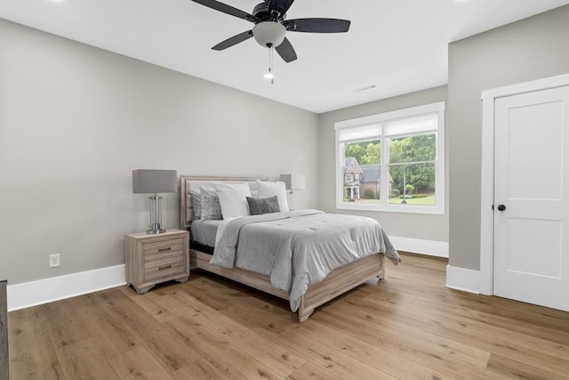 407 Estates View Dr, Acworth, GA 30101 - bedroom featuring baseboards, light wood-style flooring, and ceiling fan