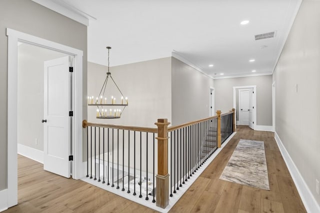 407 Estates View Dr, Acworth, GA 30101 - hallway featuring wood finished floors, a chandelier, baseboards, recessed lighting, and ornamental molding