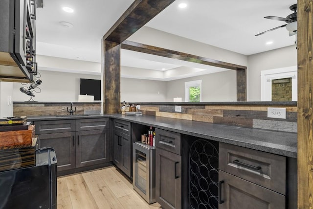 407 Estates View Dr, Acworth, GA 30101 - kitchen with wine cooler, light wood-type flooring, a ceiling fan, a sink, and recessed lighting