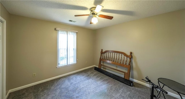 bedroom featuring visible vents, baseboards, a ceiling fan, and carpet flooring