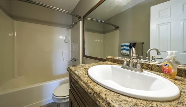 full bath with toilet, vanity, and shower / bathing tub combination