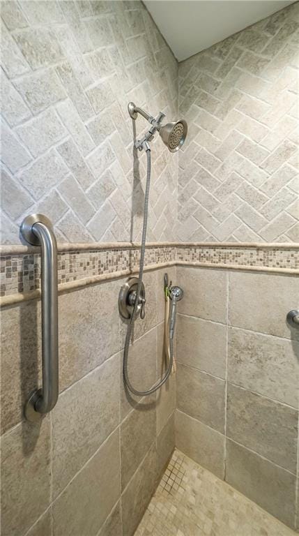 full bath featuring a tile shower