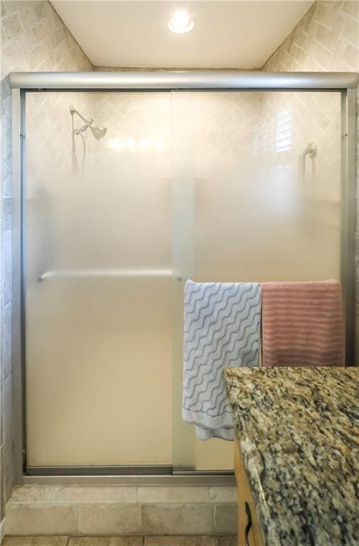 full bath featuring vanity and a stall shower