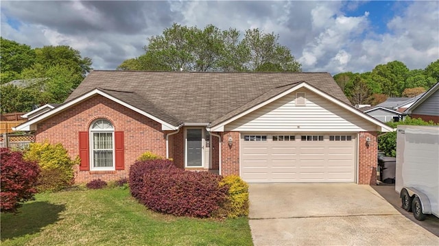 ranch-style home featuring roof with shingles, driveway, brick siding, an attached garage, and a front yard