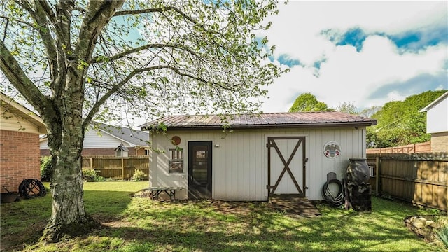 view of shed with fence