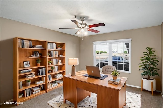 office space featuring carpet floors and ceiling fan