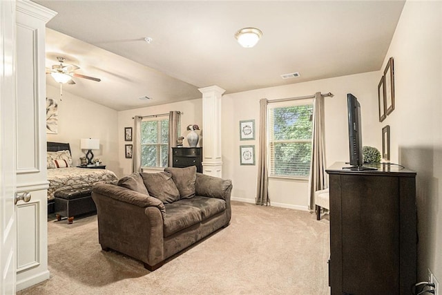 2294 Spicy Pine Ln, Lawrenceville, GA 30044 - living room with decorative columns, light carpet, healthy amount of natural light, ceiling fan, and vaulted ceiling
