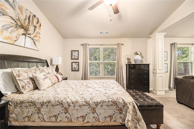 2294 Spicy Pine Ln, Lawrenceville, GA 30044 - carpeted bedroom featuring decorative columns, lofted ceiling, and ceiling fan