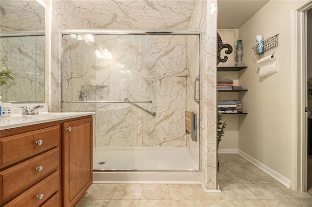 2294 Spicy Pine Ln, Lawrenceville, GA 30044 - bathroom featuring vanity, a marble finish shower, and baseboards