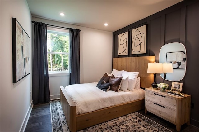 bedroom with dark wood-type flooring