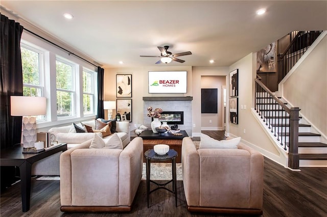 living room with ceiling fan and dark wood-type flooring