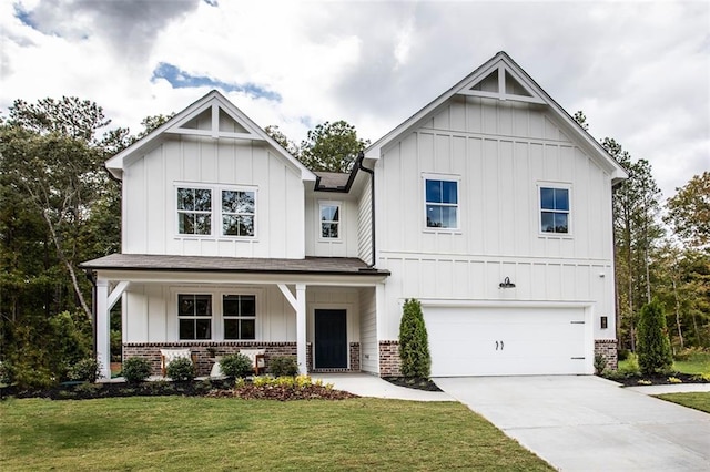 view of front of home featuring a front lawn, a porch, and a garage