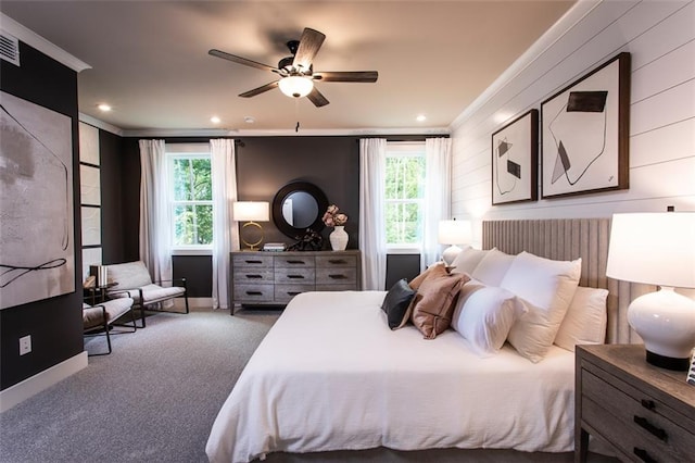 bedroom with ornamental molding, ceiling fan, and carpet floors