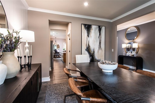 dining area with crown molding and dark hardwood / wood-style floors