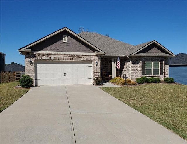 view of front of property featuring a garage and a front lawn