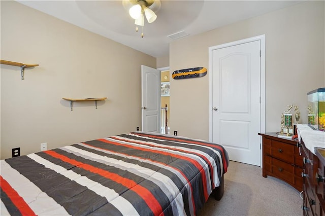 bedroom with ceiling fan and light colored carpet