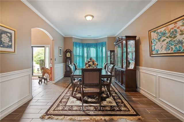 dining space with crown molding