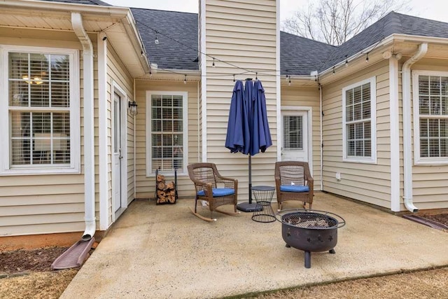 view of patio / terrace with an outdoor fire pit