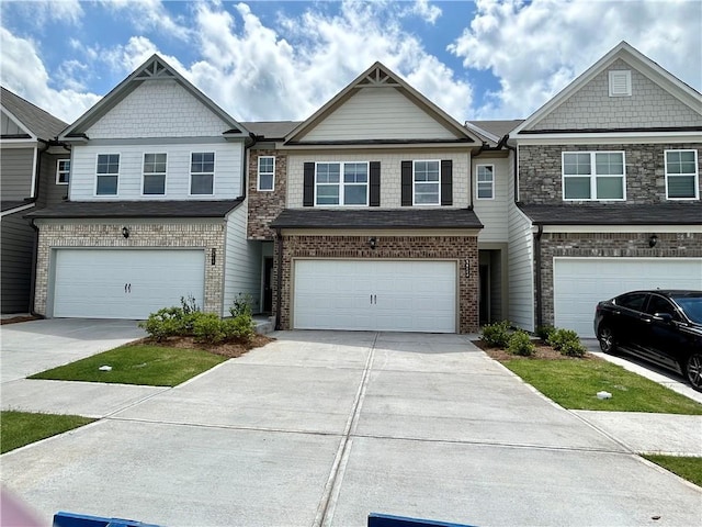 3853 Billabong Trl Unit 113, Gainesville, GA 30506 - view of property with concrete driveway, a garage, and brick siding