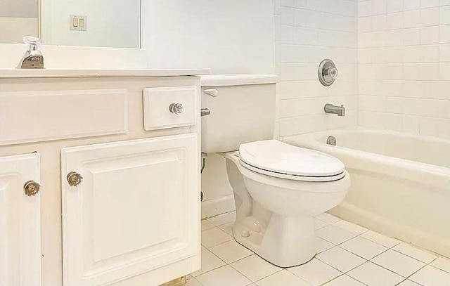 full bath with shower / washtub combination, vanity, toilet, and tile patterned floors