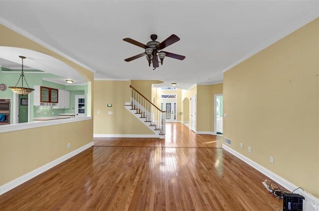 washroom featuring laundry area, baseboards, independent washer and dryer, and light wood finished floors