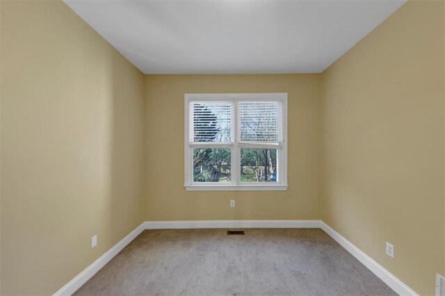 unfurnished room featuring vaulted ceiling, ceiling fan, visible vents, and a healthy amount of sunlight