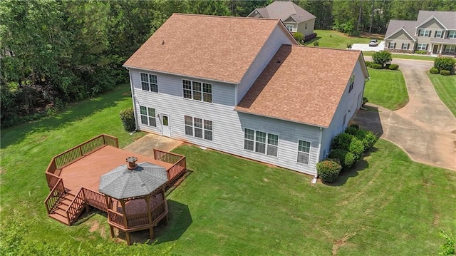 102 Plantation Dr, Lagrange, GA 30277 - rear view of house featuring a wooden deck, a lawn, and a shingled roof