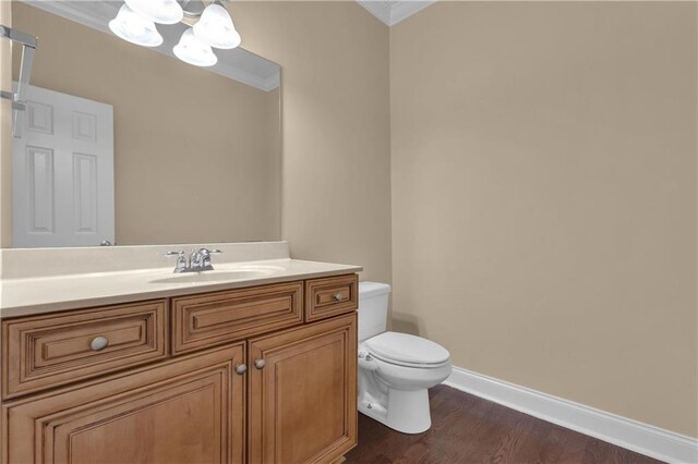 102 Plantation Dr, Lagrange, GA 30277 - half bath featuring a chandelier, crown molding, vanity, and wood finished floors
