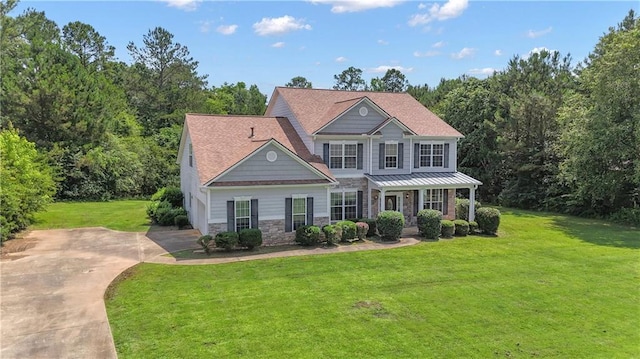 102 Plantation Dr, Lagrange, GA 30277 - view of front of home with stone siding, a front yard, and concrete driveway