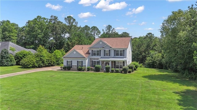 102 Plantation Dr, Lagrange, GA 30277 - view of front facade with a front yard, stone siding, and driveway