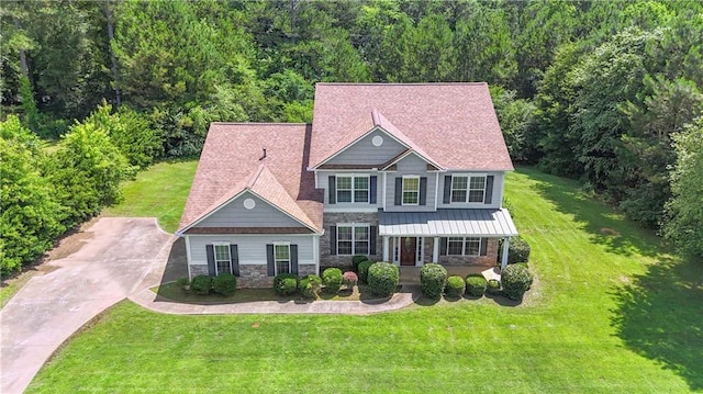 102 Plantation Dr, Lagrange, GA 30277 - view of front of property with stone siding, a front yard, a view of trees, and driveway