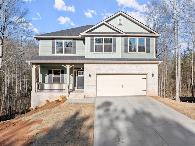 view of front of house with concrete driveway, brick siding, covered porch, and a garage
