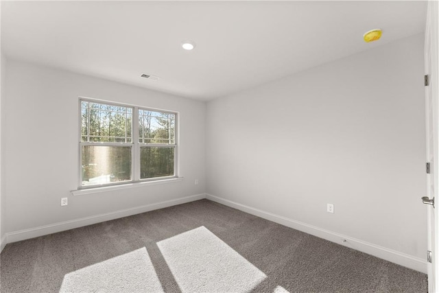 unfurnished room with carpet flooring, baseboards, and recessed lighting