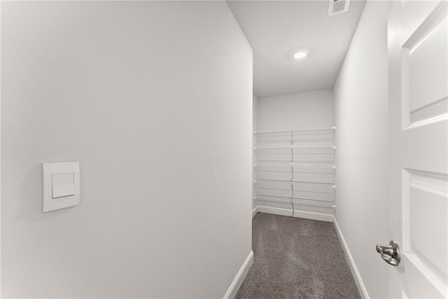 walk in closet featuring carpet flooring and visible vents