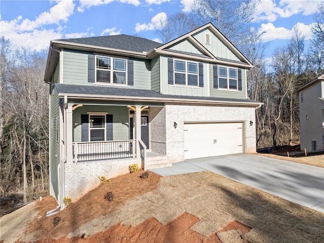 view of front of property featuring covered porch, concrete driveway, brick siding, and an attached garage