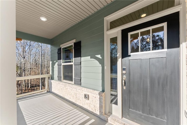 doorway to property featuring a porch