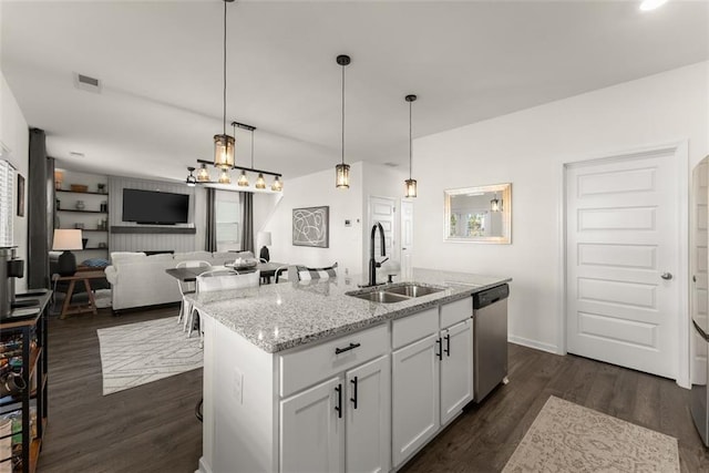 kitchen with a sink, visible vents, open floor plan, dishwasher, and dark wood finished floors