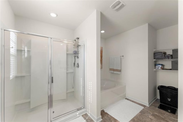 full bath featuring recessed lighting, visible vents, a shower stall, baseboards, and a bath