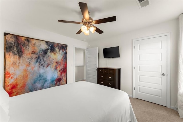 bedroom with ceiling fan, carpet floors, visible vents, and baseboards