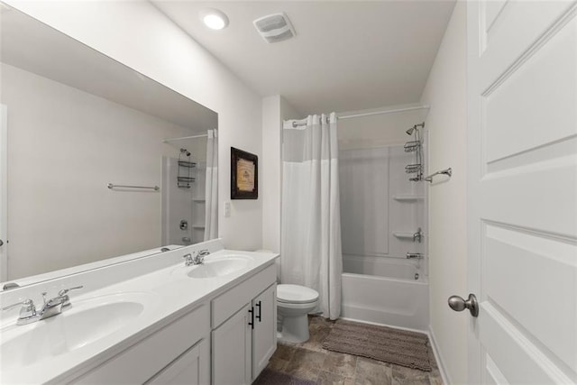 bathroom with shower / tub combo with curtain, visible vents, a sink, and toilet