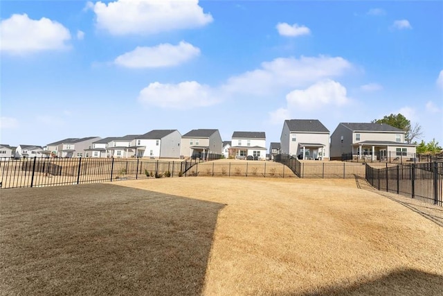 view of yard with fence and a residential view