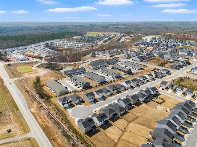 birds eye view of property with a residential view