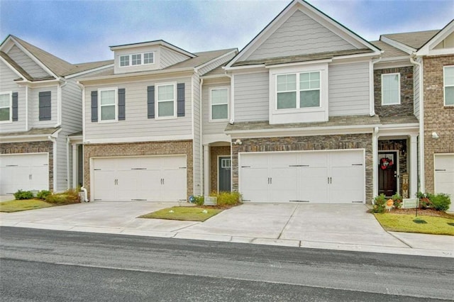 townhome / multi-family property featuring a garage